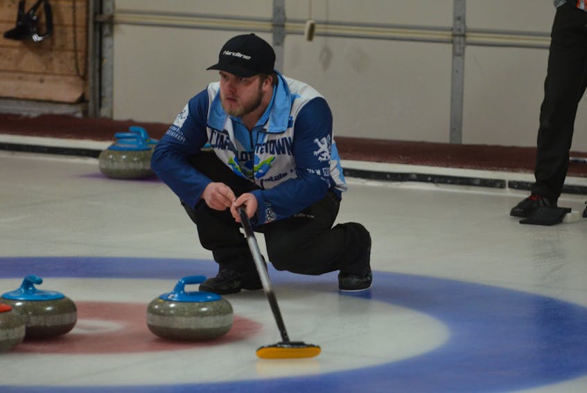 Skip Tyler Smith intently follows a shot during Saturday morning’s draw at the Pepsi provincial junior curling championships at the Crapaud Community Curling Club. Smith and his Montague Curling Rink went undefeated en route to repeating as provincial champions on Sunday.