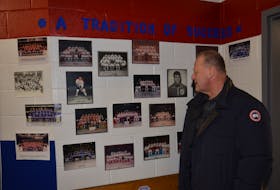 Gerard (Turk) Gallant checks out alumni photos inside the Summerside Western Capitals’ dressing room on Saturday night. Gallant, who was fired by the Vegas Golden Knights on Wednesday, was back in his hometown and attended the Caps’ 8-1 victory over the Fredericton Red Wings in the Maritime Junior Hockey League.