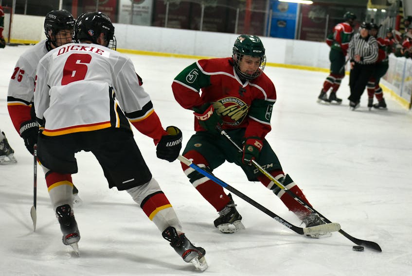 Kensington Wild defenceman Crosby Andrews looks to make a move while being closely defended by the Saint John Vitos’ Jack Dickie, 6, and Ayden Arsenault, 16. The Vitos won Saturday’s New Brunswick/Prince Edward Island Major Midget Hockey League game in Kensington 2-1 in a shootout.