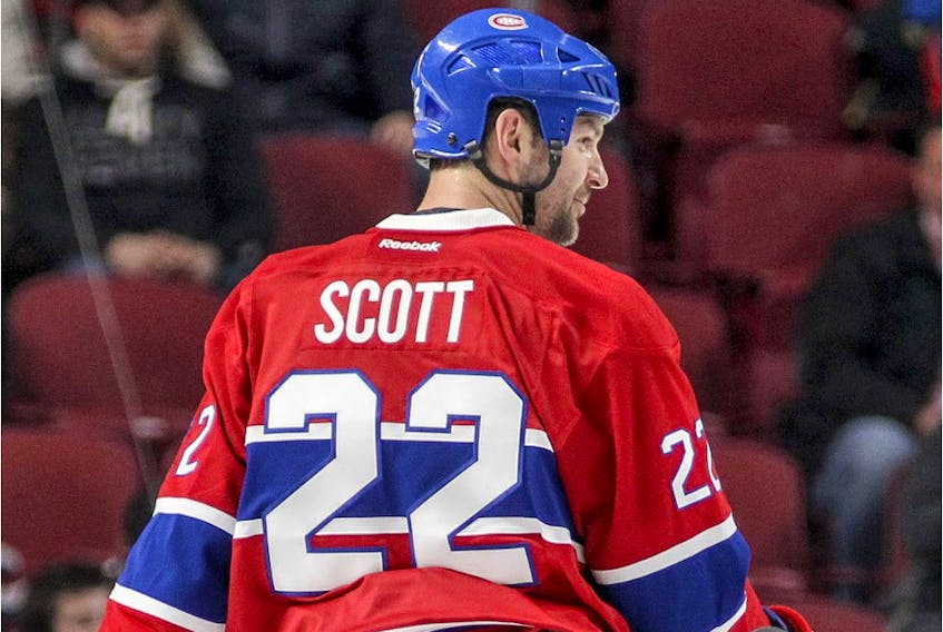 Montreal Canadiens' John Scott takes part in the warm-up prior to National Hockey League game against the Florida Panthers in Montreal Tuesday April 5, 2016.
