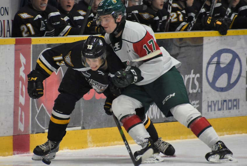 Halifax Mooseheads defenceman Cam Whynot, right, and Cape Breton Eagles forward Felix Lafrance battle for the puck during a 2019-20 QMJHL game in Sydney. (JEREMY FRASER/Cape Breton Post)
