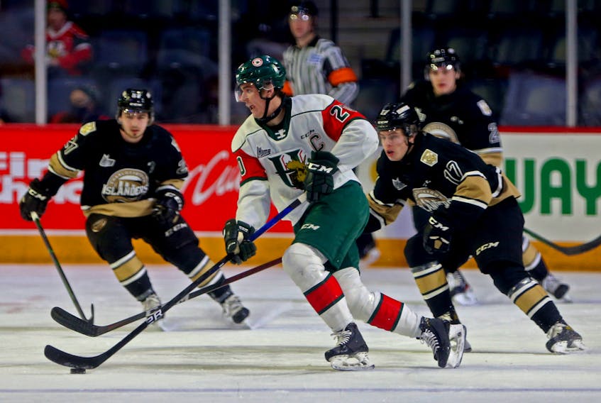 Halifax Mooseheads captain Justin Barron skates away from Charlottetown Islanders forward Sam Oliver during Sunday's QMJHL game at the Scotiabank Centre. - Tim Krochak
