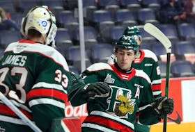 Halifax Mooseheads centre Elliot Desnoyers and goalie Brady James celebrate a goal during a Nov. 6, 2020 game against the Charlottetown Islanders at the Scotiabank Centre. (ERIC WYNNE/Chronicle Herald)
