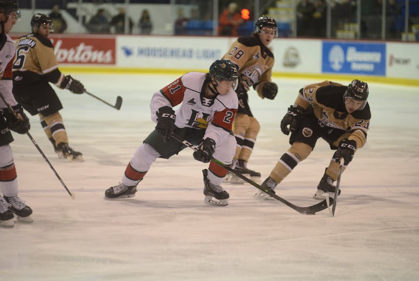 Halifax Mooseheads centre Cole Foston, left, protects the puck from Charlottetown Islanders centre Zac Beauregard Wednesday during Quebec Major Junior Hockey League action at the Eastlink Centre in Charlottetown. (JASON MALLOY/Charlottetown Guardian)