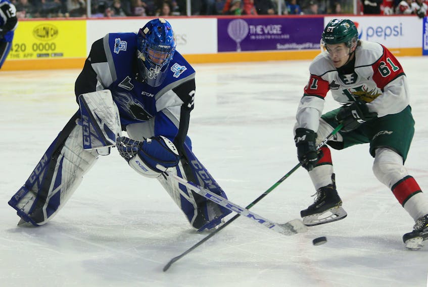Halifax Mooseheads forward Ozzie King and Saint John Sea Dogs goalie Zachary Bouthillier battle for the puck during Sunday's QMJHL game at the Scotiabank Centre. (TIM KROCHAK/Chronicle Herald)