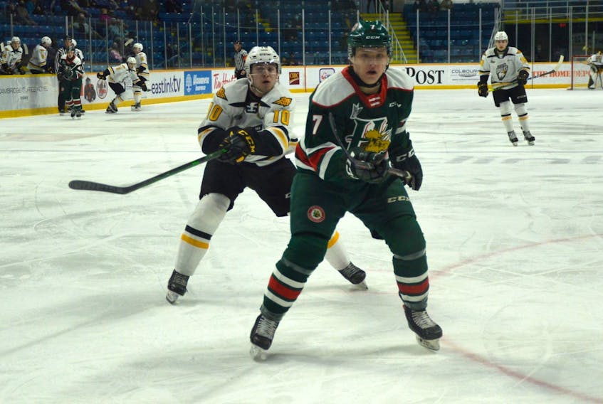 Lucas Robinson of the Halifax Mooseheads, right, is chased down by Connor Trenholm of the Cape Breton Eagles during Quebec Major Junior Hockey League action at Centre 200 on Wednesday. Halifax won the game 4-1.