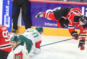 Halifax Mooseheads defenceman Justin Barron trips up Quebec Remparts forward Edouard Cournoyer early in the first period of Friday's QMJHL game at the Scotiabank Centre. (ERIC WYNNE/Chronicle Herald)