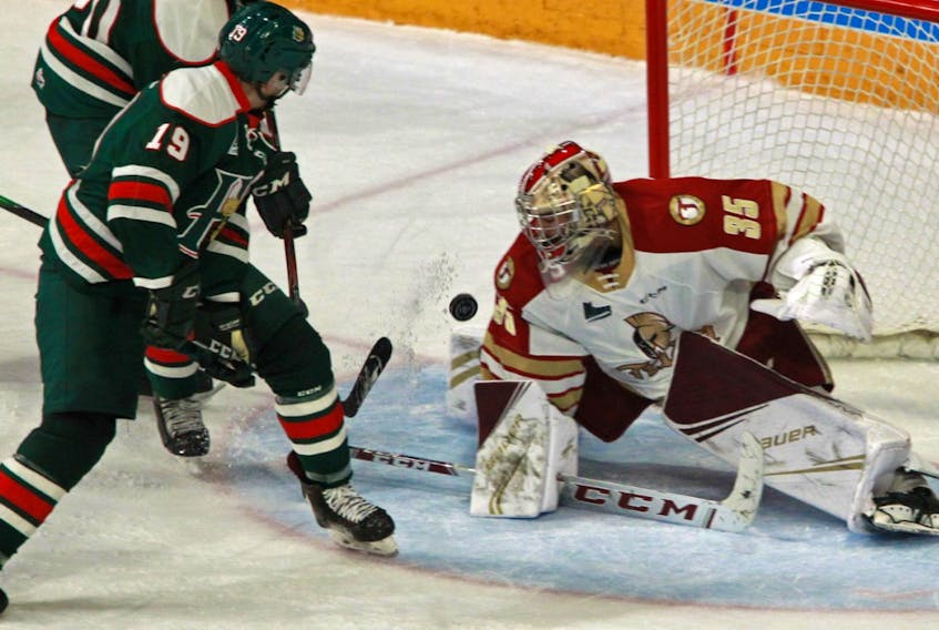 Halifax  Mooseheads centre Bo Groulx scores a highlight-reel, between-the-legs goal on Bathurst Titan goalie Tristan Berube during their QMJHL game at the Scotiabank Centre. (TIM KROCHAK/ The Chronicle Herald)
