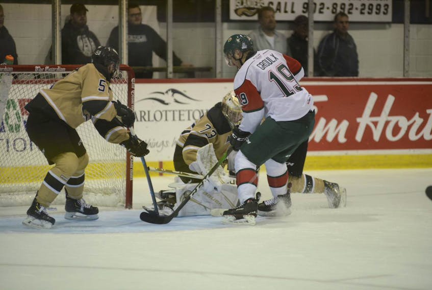 Charlottetown Islanders goalie Matthew Welsh makes the pad save with Halifax Mooseheads centre BO Groulx looking for the rebound during Quebec Major Junior Hockey League action Monday in Charlottetown. (Jason Malloy/The Guardian)