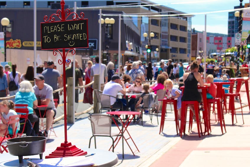 During peak hours on sunny days, waiting for a table is not uncommon at the newly constructed patios in downtown St. John’s. Pictured here is the patio of Mussels On The Corner, a seafood restaurant owned by Brenda O’Reilly and located at 318 Water Street. – Andrew Waterman/The Telegram
