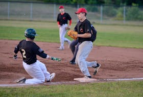 Morell Chevies’ first baseman Darcy Affleck, right, beats The Alley Stratford Athletics’ Ryne MacIsaac to the base on a ground ball early in Game 1 of the Kings County Baseball League final Wednesday at MacNeill Field.