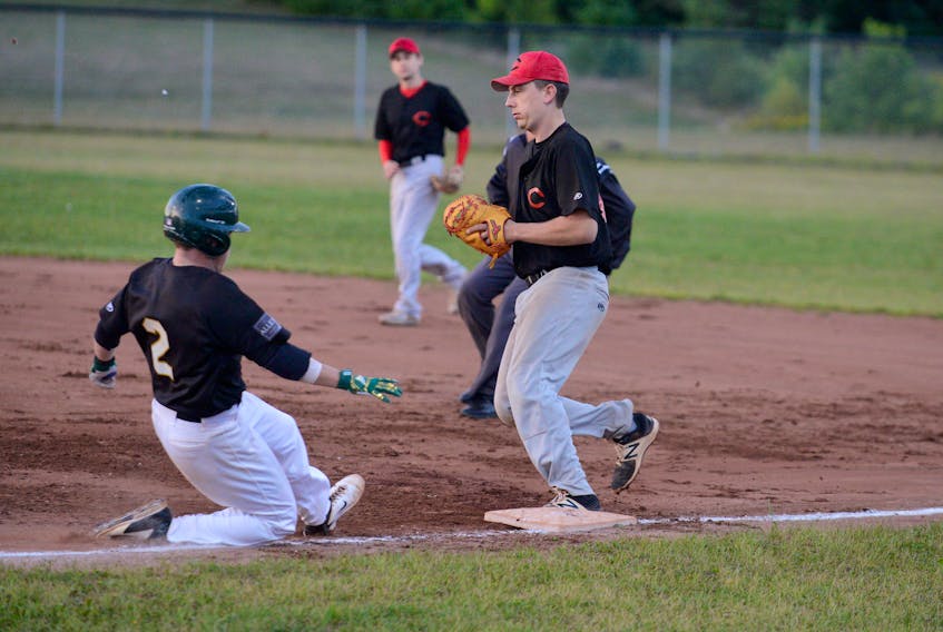 Morell Chevies’ first baseman Darcy Affleck, right, beats The Alley Stratford Athletics’ Ryne MacIsaac to the base on a ground ball early in Game 1 of the Kings County Baseball League final Wednesday at MacNeill Field.