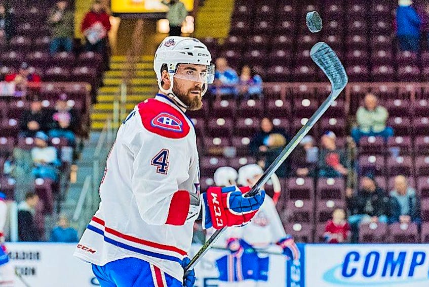 The St. John’s IceCaps’ Morgan Ellis toys with a puck during warmup at Mile One Centre earlier this season. While other players have seen more action when summoned to the parent club Montreal Canadiens, Ellis hasn’t been afforded the same opportunity to bring his solid game to the NHL level.