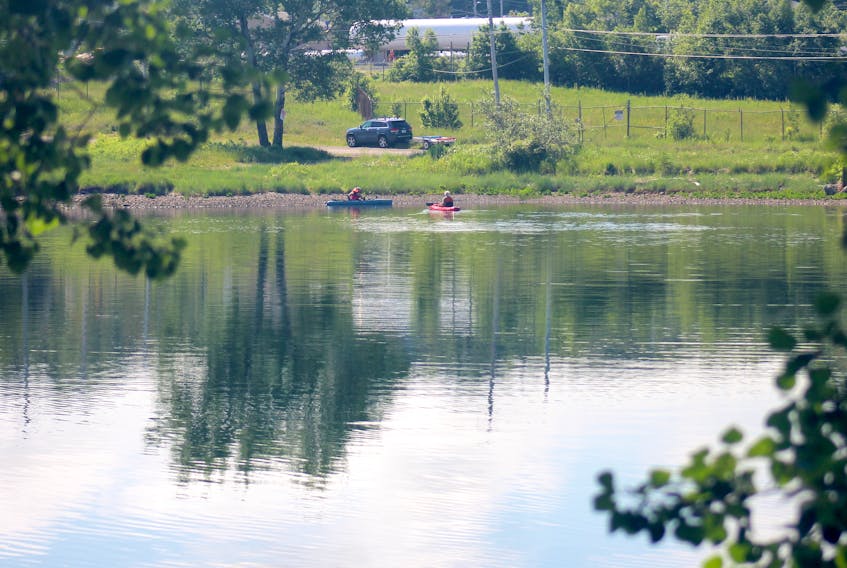 Two kayakers return to shore after a morning paddle on Sydney harbour Thursday. It was a sunny day with the temperatures expected to reach a high of 29 C. Chris Connors/Cape Breton Post