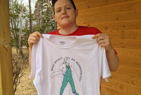 Mikey Wasnidge, co-owner of the Nimrods’ restaurant in Charlottetown, holds up the T-shirt that he and his business partners created as a tribute to Dr. Heather Morrison, P.E.I.’s chief pubic health officer. The T-shirts will be on sale for the next two weeks at https://nimrods.staygolden.ca/ with $10 from each sale going to the United Way of P.E.I. 