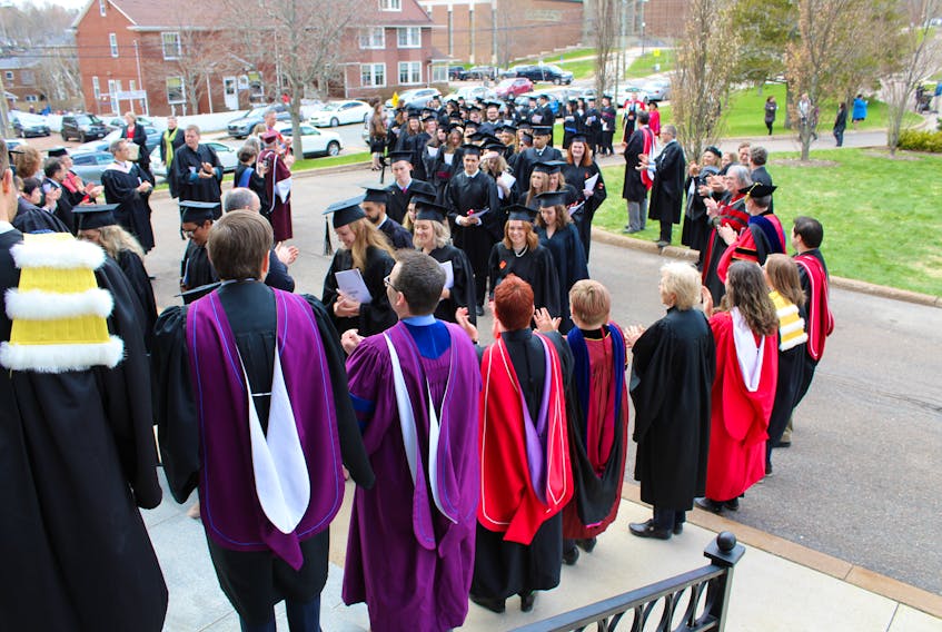 Mount Allison University's convocation ceremony for the Class of 2020 has been postponed due to concerns over the COVID-19 pandemic. The ceremony will be held at a later date and degrees will be conferred to students with details currently being worked out. Above, Mount Allison faculty members applaud the graduates as they enter Convocation Hall last May.