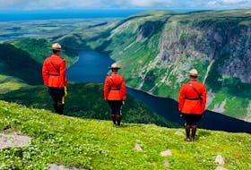 Deer Lake RCMP officers (from left) Const. Guy Boudreau, Cpl. Elizabeth Lodge and Const. Jensen Stanley recently climbed Gros Morne Mountain and then donned their Red Serge uniforms to have some photos taken. 
Photo Courtesy of Bradley Lodge