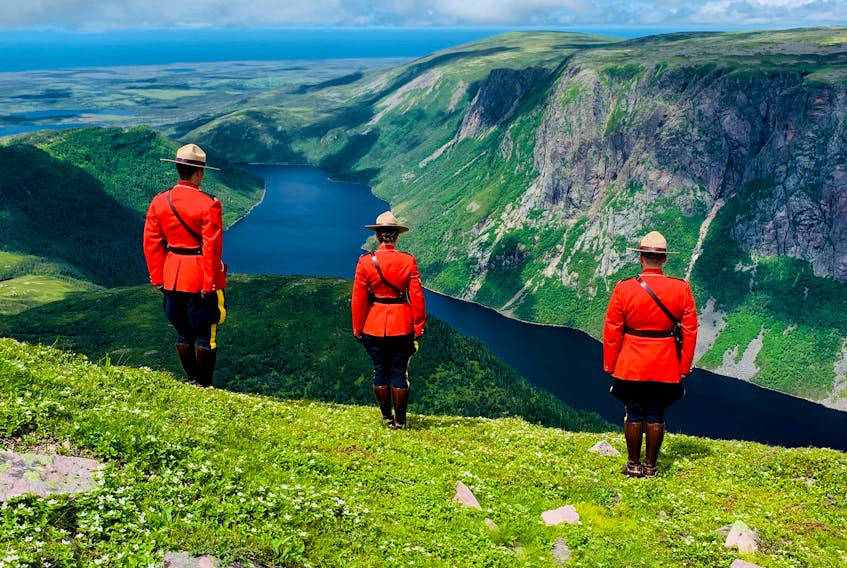 Deer Lake RCMP officers (from left) Const. Guy Boudreau, Cpl. Elizabeth Lodge and Const. Jensen Stanley recently climbed Gros Morne Mountain and then donned their Red Serge uniforms to have some photos taken. 
Photo Courtesy of Bradley Lodge