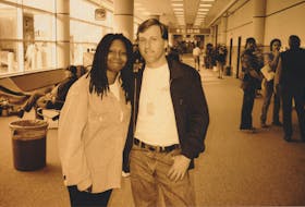 Whoopi Goldberg poses with Scott MacDonald in an unidentified airport. CONTRIBUTED
