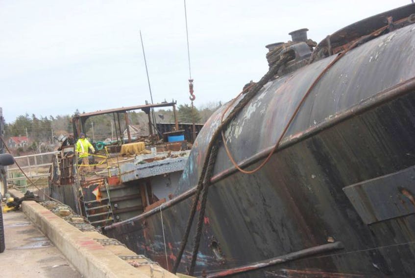Contractors begin work at removal of the Farley Mowat last week beginning with removal of the ship’s engines