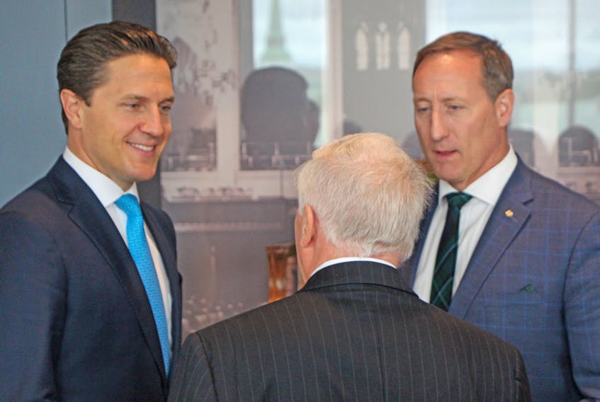 Mark (left), one of Brian and Mila Mulroney’s sons, chats with guests, including former Central Nova MP Peter MacKay, during the grand opening celebration for the Brian Mulroney Institute of Government and Mulroney Hall on the St. F.X. campus. - Corey LeBlanc