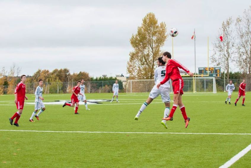 <p>Tiuri Lomond of the Memorial Sea-Hawks and Jeff Moore (5) of the UPEI Panthers go high for the ball during AUS men’s soccer action in Charlottetown. P.E.I., on Saturday.</p>