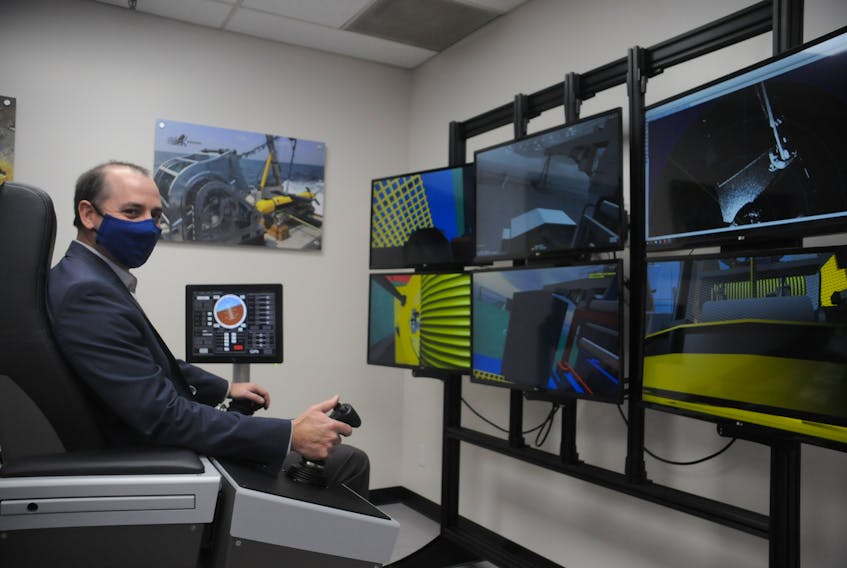 Joe Singleton, assistant head of the Marine Institute's school of ocean technology, sits at one of the new simulators students will use in the underwater exploration laboratory. — Andrew Robinson/The Telegram