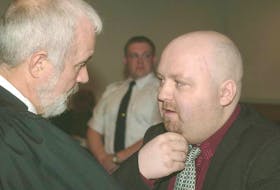 Brian Doyle (right) speaks to lawyer John Duggan in Newfoundland and Labrador Supreme Court in St. John’s in 2002. TELEGRAM FILE PHOTO