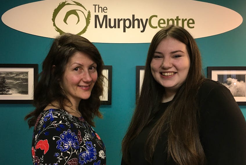 Lindsay Oates (left) co-ordinator of an upcoming career expo chats with Murphy Centre client Danika Carter. BARB SWEET/THE TELEGRAM