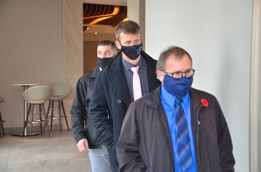Halifax Regional Police constables Ryan Morris and Justin Murphy follow Special Const. Stephan Longtin into a police review board hearing last year. - Francis Campbell / File