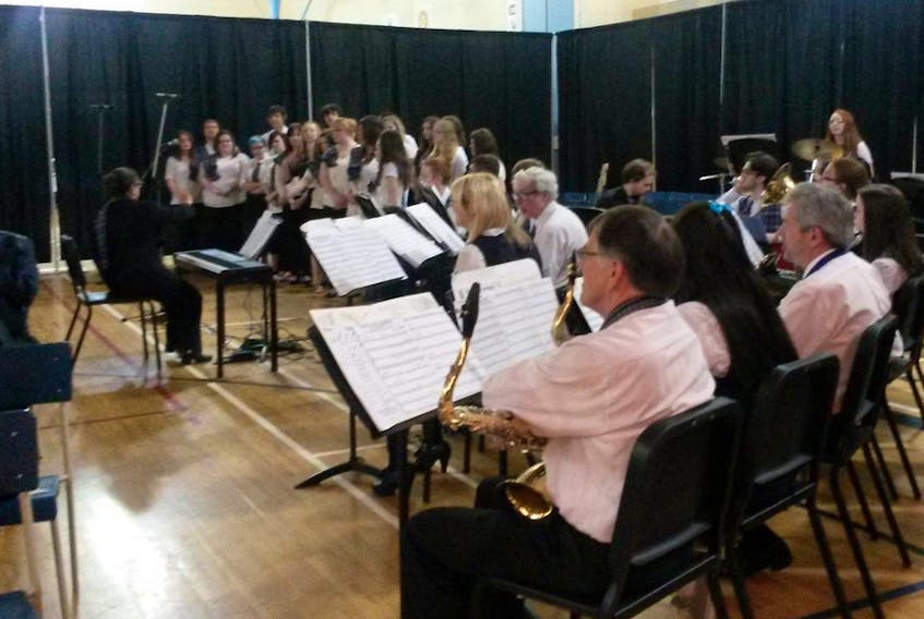 Members of the community join with members of the Sydney Academy band during a recent event in Sydney. CONTRIBUTED


