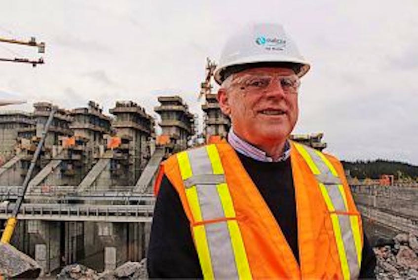['James McLeod/The Telegram<br />Nalcor CEO\u2008Ed Martin speaks to reporters atop the Muskrat Falls construction site, to announce that the project is now $1.4 billion over budget, and will be delayed from the expected first power in 2017 until some time in 2018.']