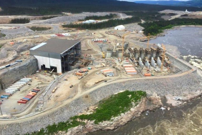 Aerial view of the Muskrat Falls generation site. The powerhouse and intake is on the left and the spillway is on the right. — Photo from the Muskrat Falls Project Monthly Report July 2015