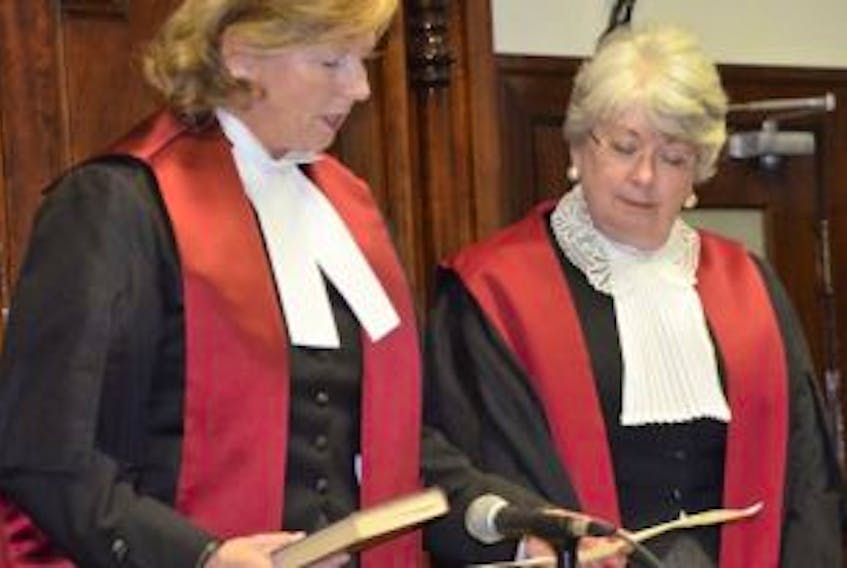 ['Nancy Key (left) is sworn in as a Justice in the Supreme Court of P.E.I. during a ceremony Monday at the provincial courthouse in Summerside. Conducting the ceremony is Chief Justice Jacqueline Matheson.']