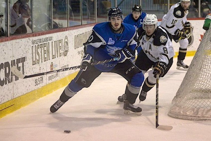 Saint John Sea Dogs forward Nathan Noel, left, in action against the Charlottetown Islanders in March.