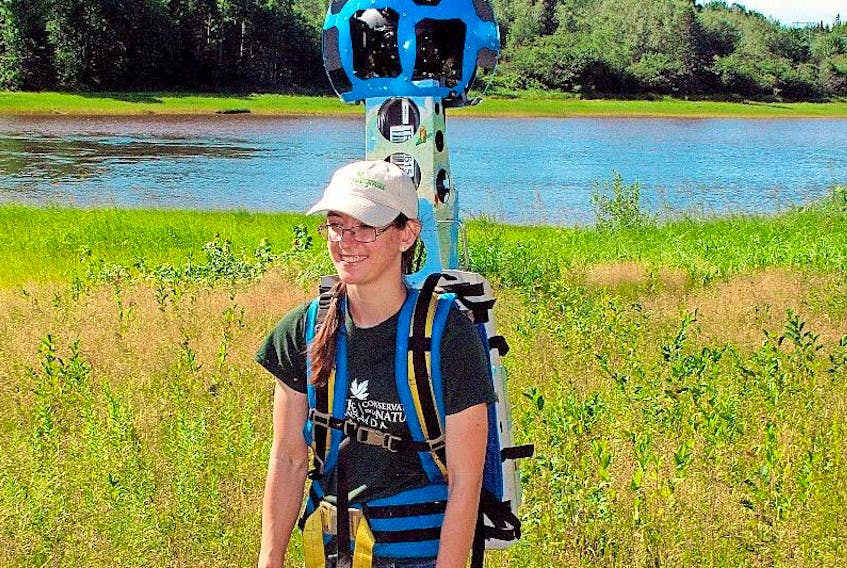 Danielle Horne, Nova Scotia stewardship assistant with the Nature Conservancy of Canada, walks with the Google Trekker through the Pugwash Estuary last summer. The 3.5-km trail can now be experienced on the NCC website or through Google Street View.