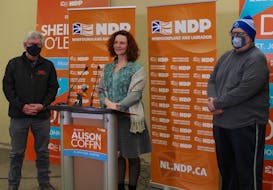 NDP Leader Alison Coffin (centre) stopped by the headquarters of Jim Dinn (left), the NDP candidate for St. John's Centre, to announce their plan to introduce a home heating rebate of up to $250 for people in the province making less than $40,000 a year, and up to $500  for people living in coastal Labrador. Longtime NDP member Edward Sawdon (right) said he used to be eligible for the former home heating rebate program, which was cut by the Liberal government in 2016. It helped him offset the high cost of his light bill, he said. — Andrew Waterman/The Telegram