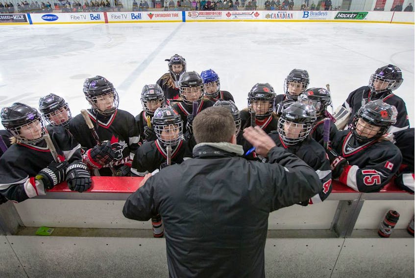  Head coach Rob Ronberg talks to his team, the Nepean Wildcats in the Girls Atom AA division.