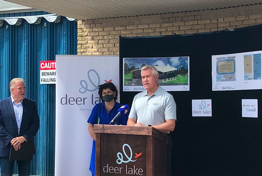 Premier Dwight Ball was joined by Deer Lake Mayor Dean Ball, left, and Long Range Mountains MP Gudie Hutchings to announce an annex will be built on the Hodder Memorial Recreation Complex in Deer Lake on Tuesday.