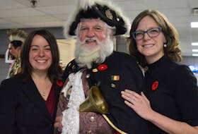 <p>Dist. 10 Coun. Kendra Coombes, left, and Dist. 8 Coun. Amanda McDougall, took a moment to pose for a photo with town crier Allie MacInnis after being sworn in as new members of CBRM council at a ceremony at Centre 200 in Sydney Friday.</p>