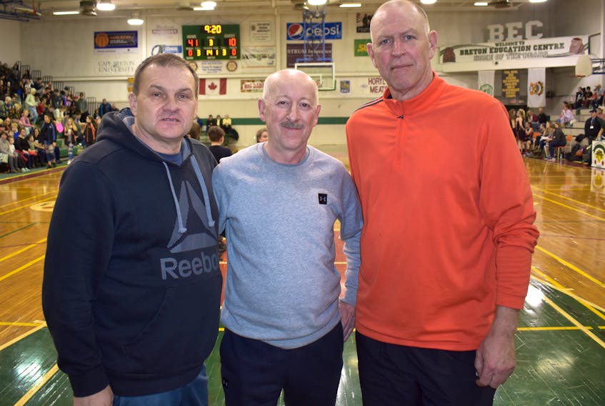 Officials, from left, Dale Farish, Nick Morash and Paul DeBelie, stand for a picture prior to the Breton Education Centre Bears’ game at the New Waterford Coal Bowl Classic on Tuesday. Morash and DeBelie have been officiating at the high school basketball tournament for more than 23 years, while Farish has been attending the event as a coach and official since 1991. JEREMY FRASER/CAPE BRETON POST