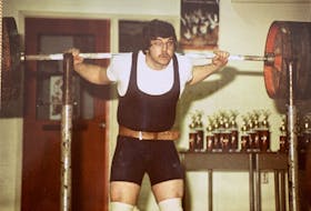 Glen Hutchison competing in a powerlifting event in the early years of his 45-year career in the sport. Hutchison still goes to the gym and remains active as he battles cancer. CONTRIBUTED • GLEN HUTCHISON
