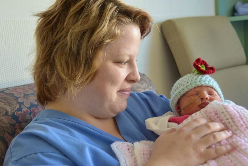 <p>&nbsp;</p>
<p>At the Prince County Hospital, Jillian Culleton holds her daughter, Kallie, who was born at 12:05 a.m. on New Year’s Day, and she was the first baby born on the Island in 2016.</p>