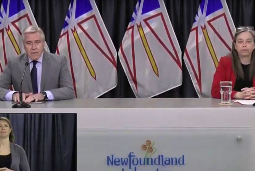 Newfoundland and Labrador Premier Dwight Ball and Chief Medical Officer Janice Fitzgerald give a video briefing Monday on COVID-19 in the province. Inset: ASL interpreter Heather Crane. (Image from video)