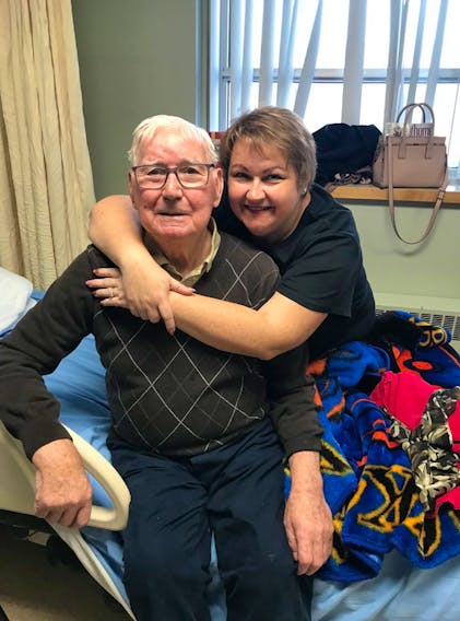 Shelley Esposto hugs her father, Augustus, at the Corner Brook Long-Term Care Centre in December 2019.