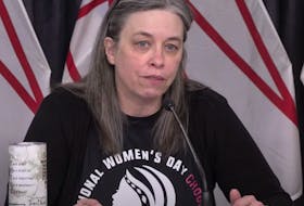 Chief Medical Officer of Health Dr. Janice Fitzgerald wore an International Women's Day sweatshirt for Monday's COVID-19 briefing. (image from YouTube)