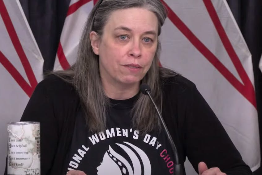 Chief Medical Officer of Health Dr. Janice Fitzgerald wore an International Women's Day sweatshirt for Monday's COVID-19 briefing. (image from YouTube)