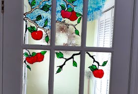 Denise Howlett of Mount Pearl is using her time at home during the COVID-19 pandemic to try a stained glass technique for her French doors. — CONTRIBUTED