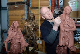 In this file photo Morgan MacDonald works on a clay statue of Demasduit, one of three he sculpted in 2018 as a personal project to help tell and commemorate the history of the Beothuk people. Also shown are sculptures of Shanawdithit (far left) and Nonosabasut (in bronze) in his foundry shop in Logy Bay. Saltwire File Photo 
