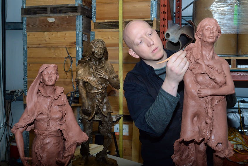 In this file photo Morgan MacDonald works on a clay statue of Demasduit, one of three he sculpted in 2018 as a personal project to help tell and commemorate the history of the Beothuk people. Also shown are sculptures of Shanawdithit (far left) and Nonosabasut (in bronze) in his foundry shop in Logy Bay. Saltwire File Photo 